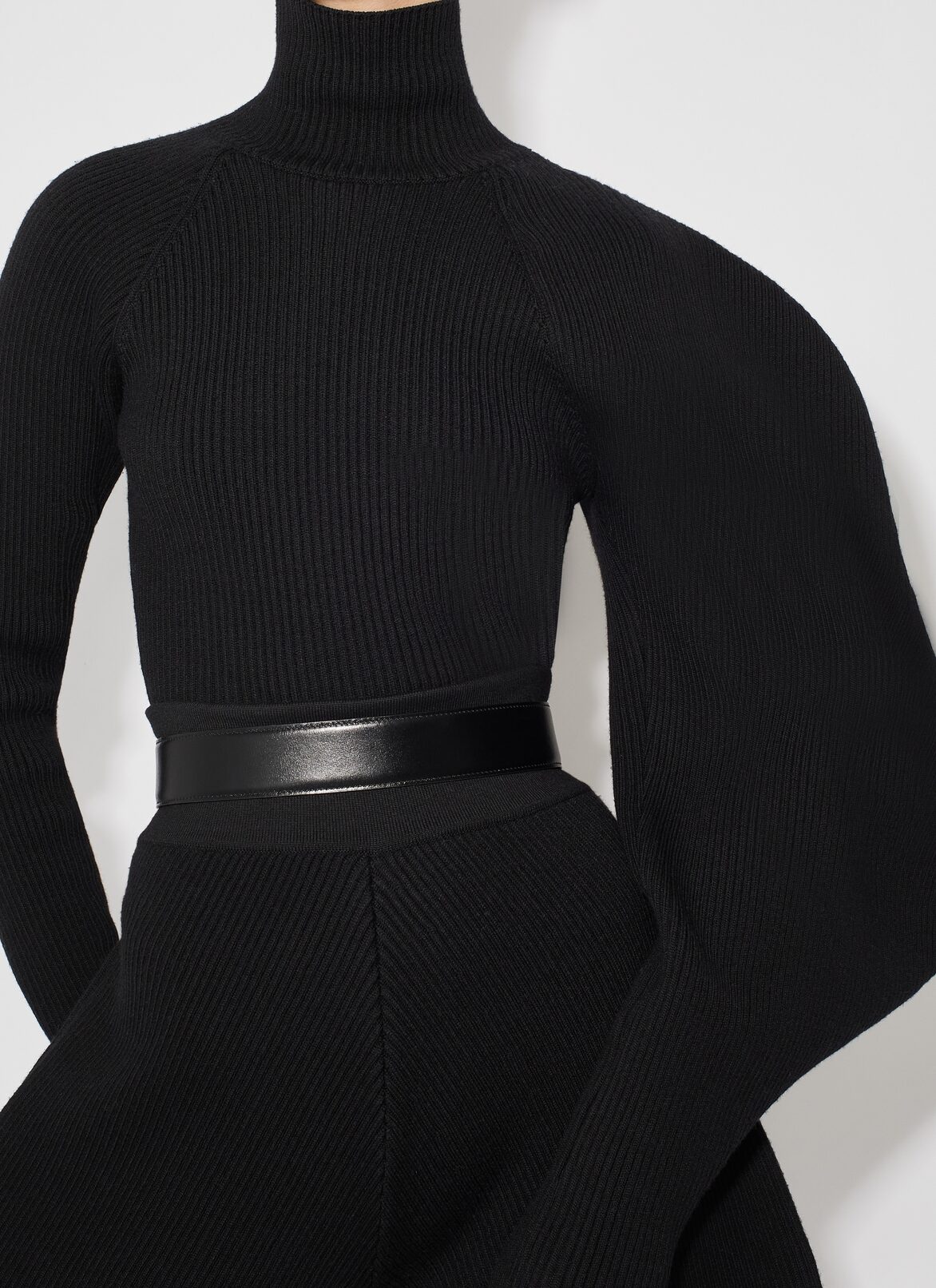 Asymetric sculptural rib knit sweater ALAÏA BLACK ASYMETRIC SCULPTURAL RIB KNIT SWEATER